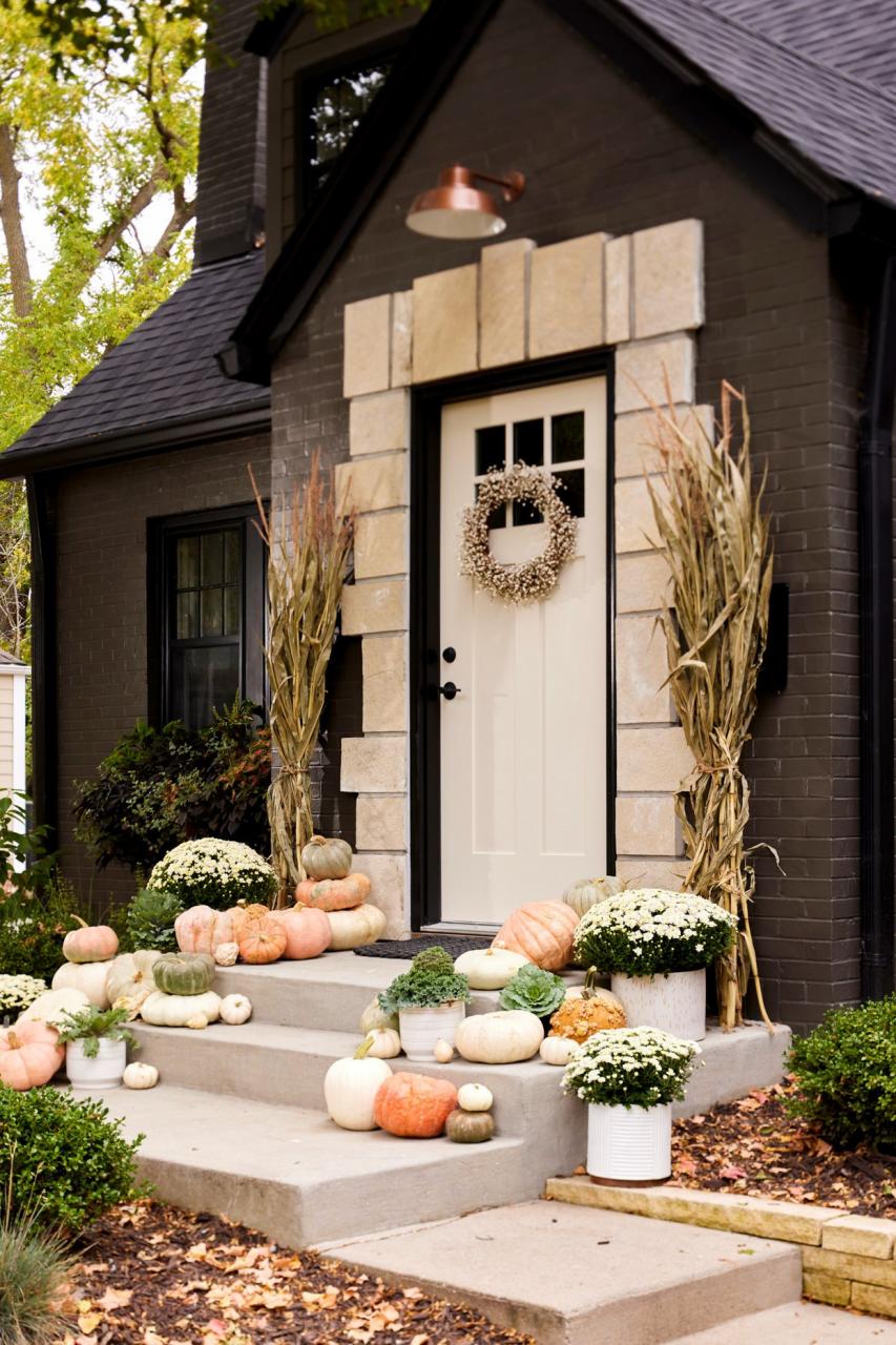 assorted gourds fall decor front cement steps
