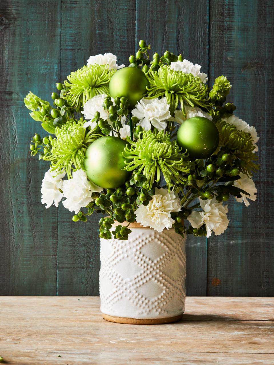 bright green and white flowers in glass vase