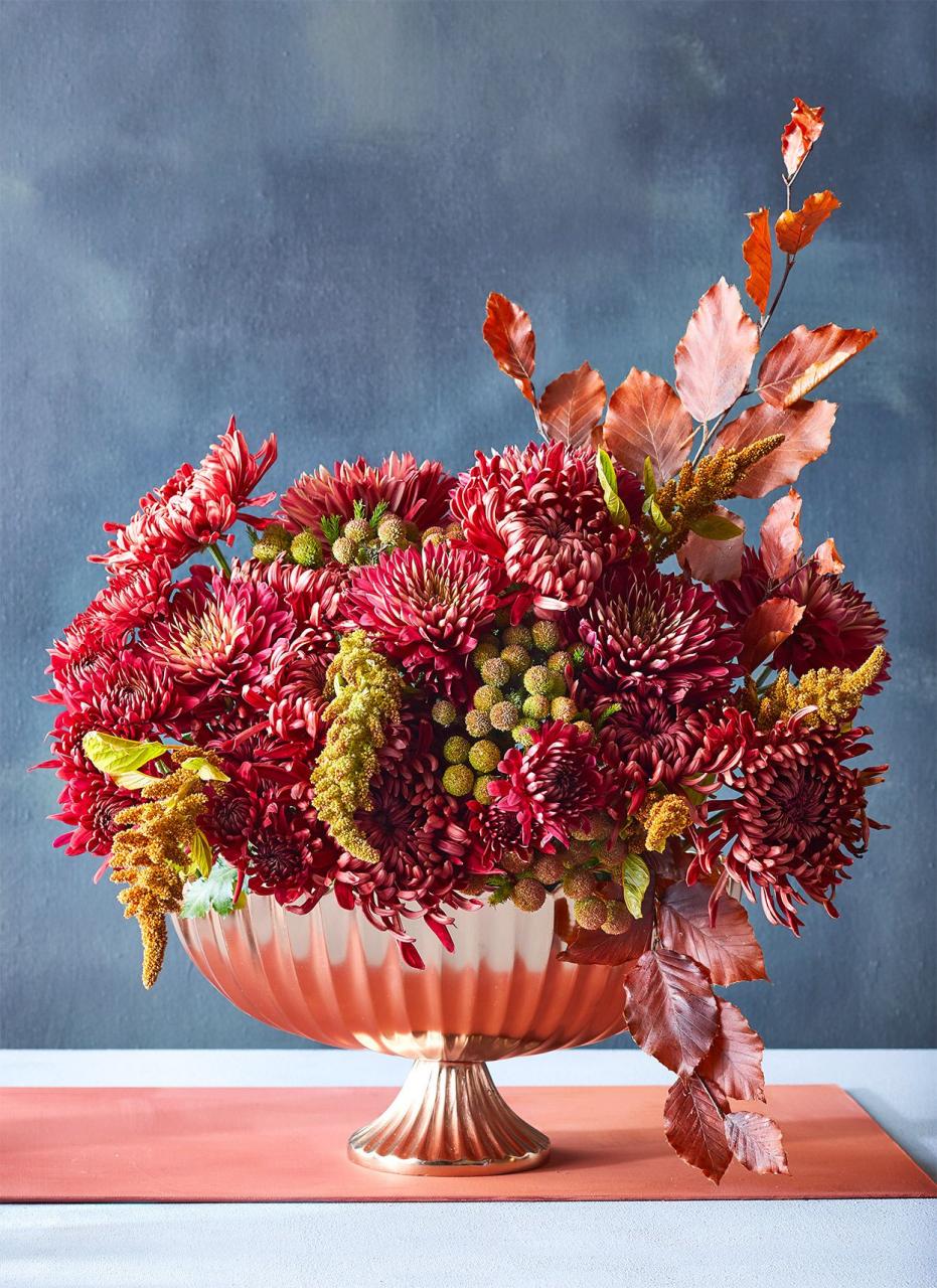 red mums and amaranth in copper vase
