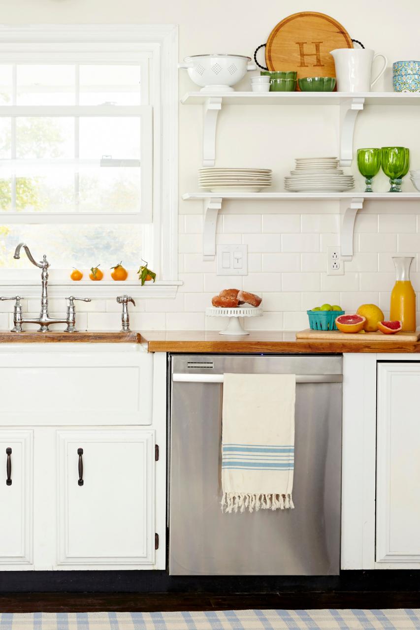 white kitchen shelves with silver dishwasher
