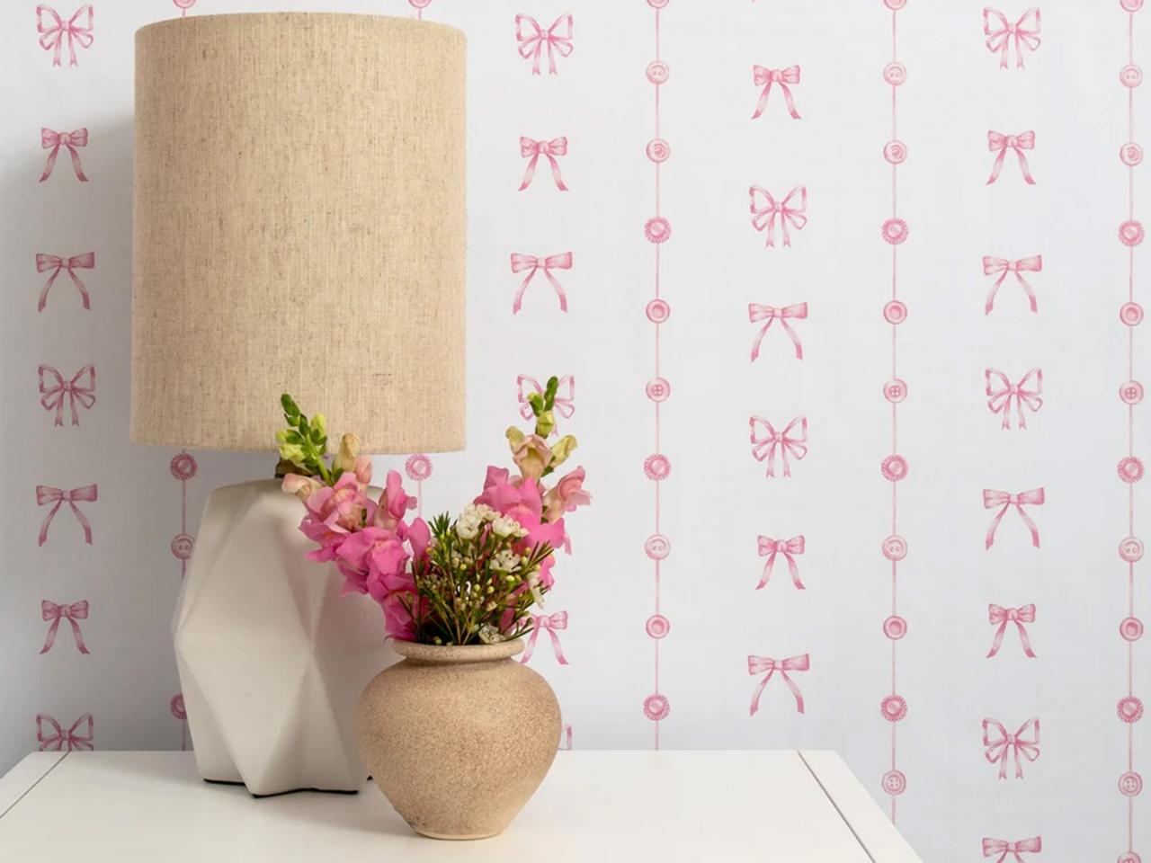 Wallpaper with pink bow and button print