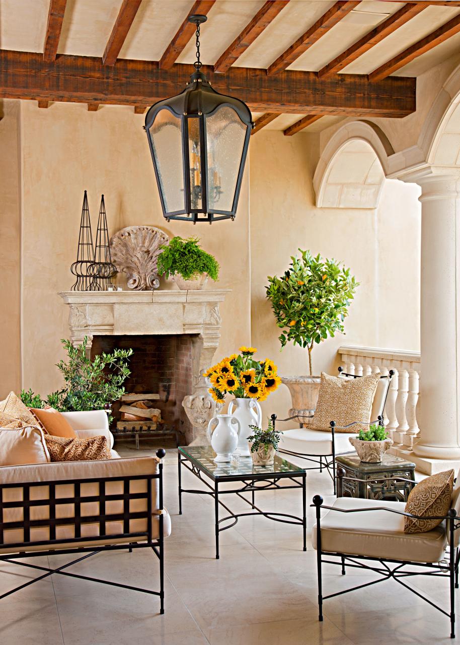 Italian-style outdoor terrace with pendant lamp and fireplace