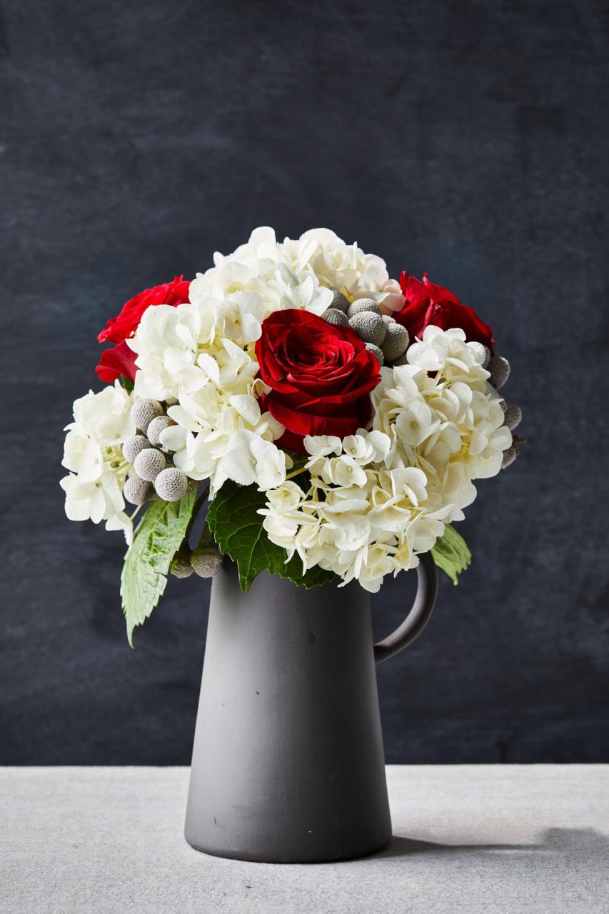 white and red flowers in vase